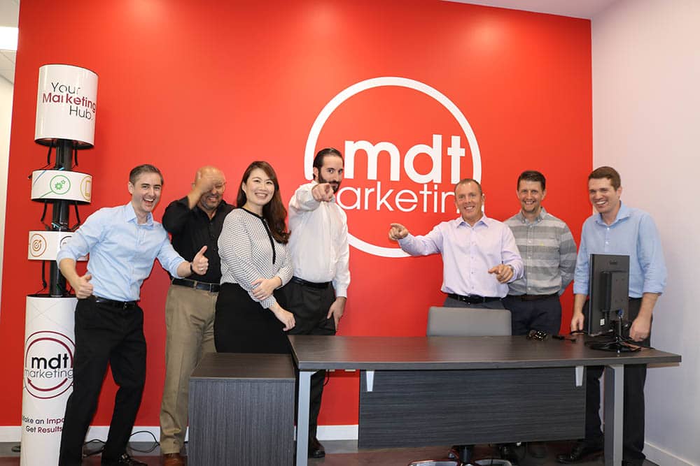 Marketing team standing together